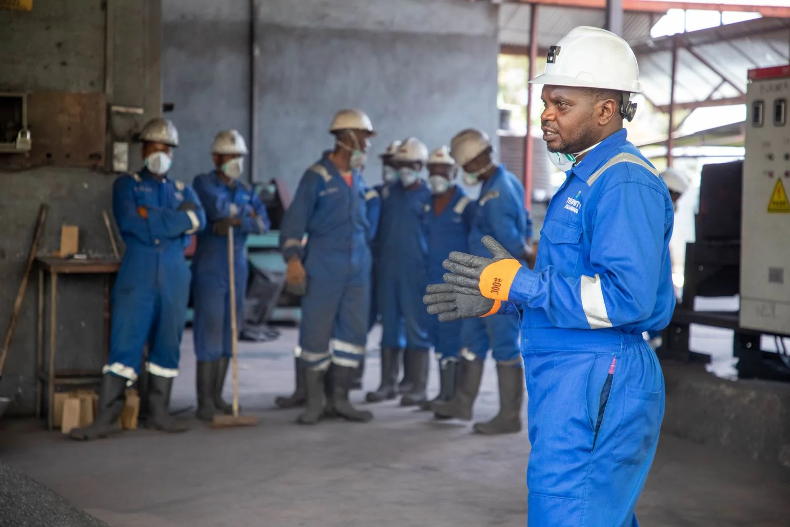 Workers in safety gear during an industrial safety training session